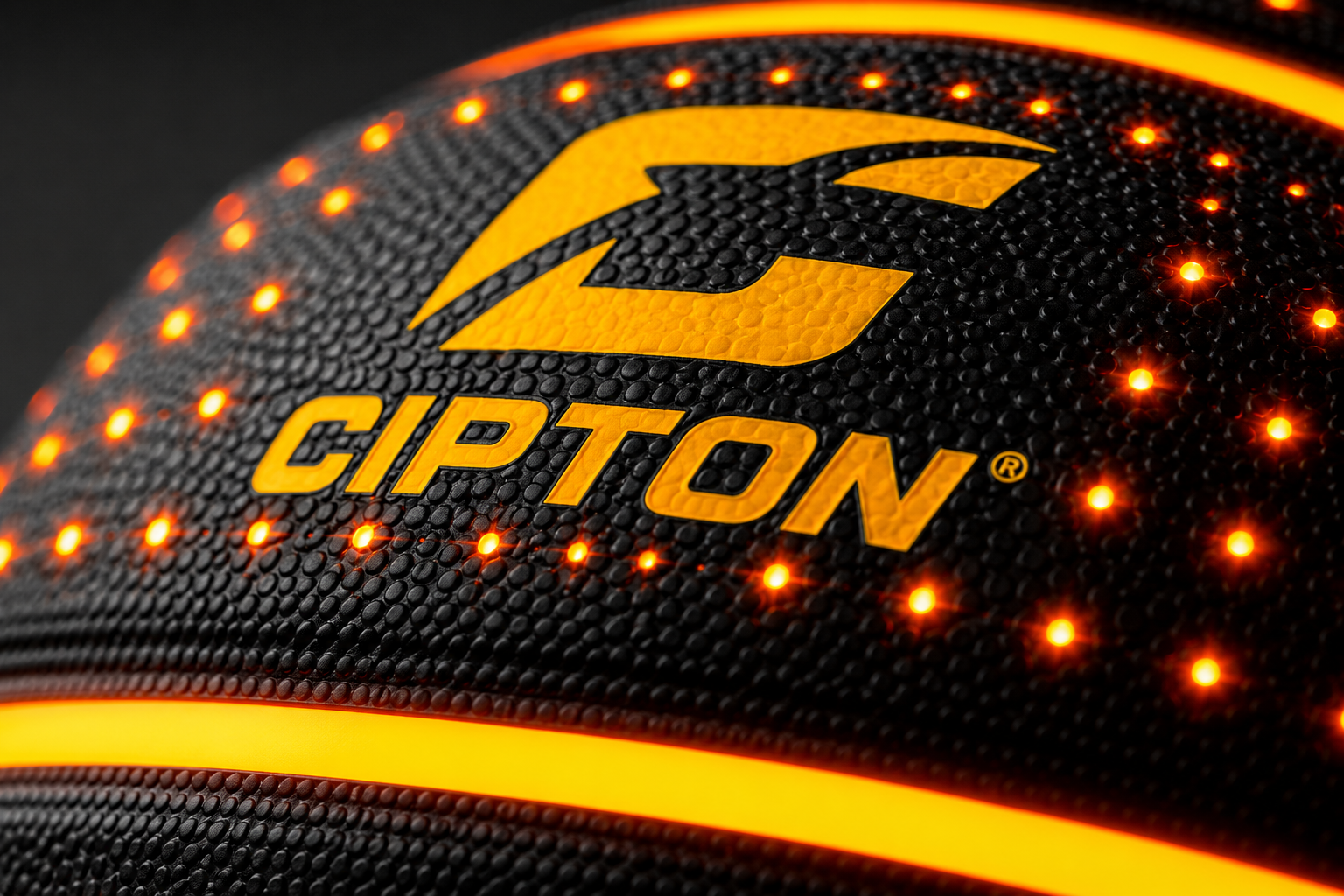 Close-up of the CIPTON logo on the LED basketball's pebbled composite leather
