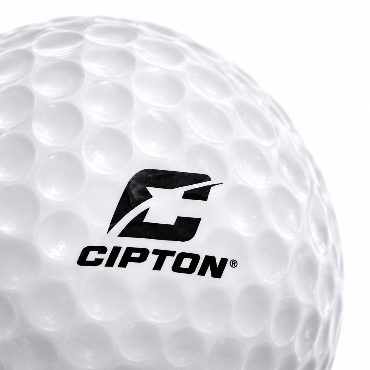 Close-up of the CIPTON logo on a dimpled LED golf ball, angled