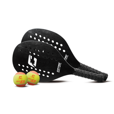 Two black CIPTON beach tennis paddles with three balls, angled view