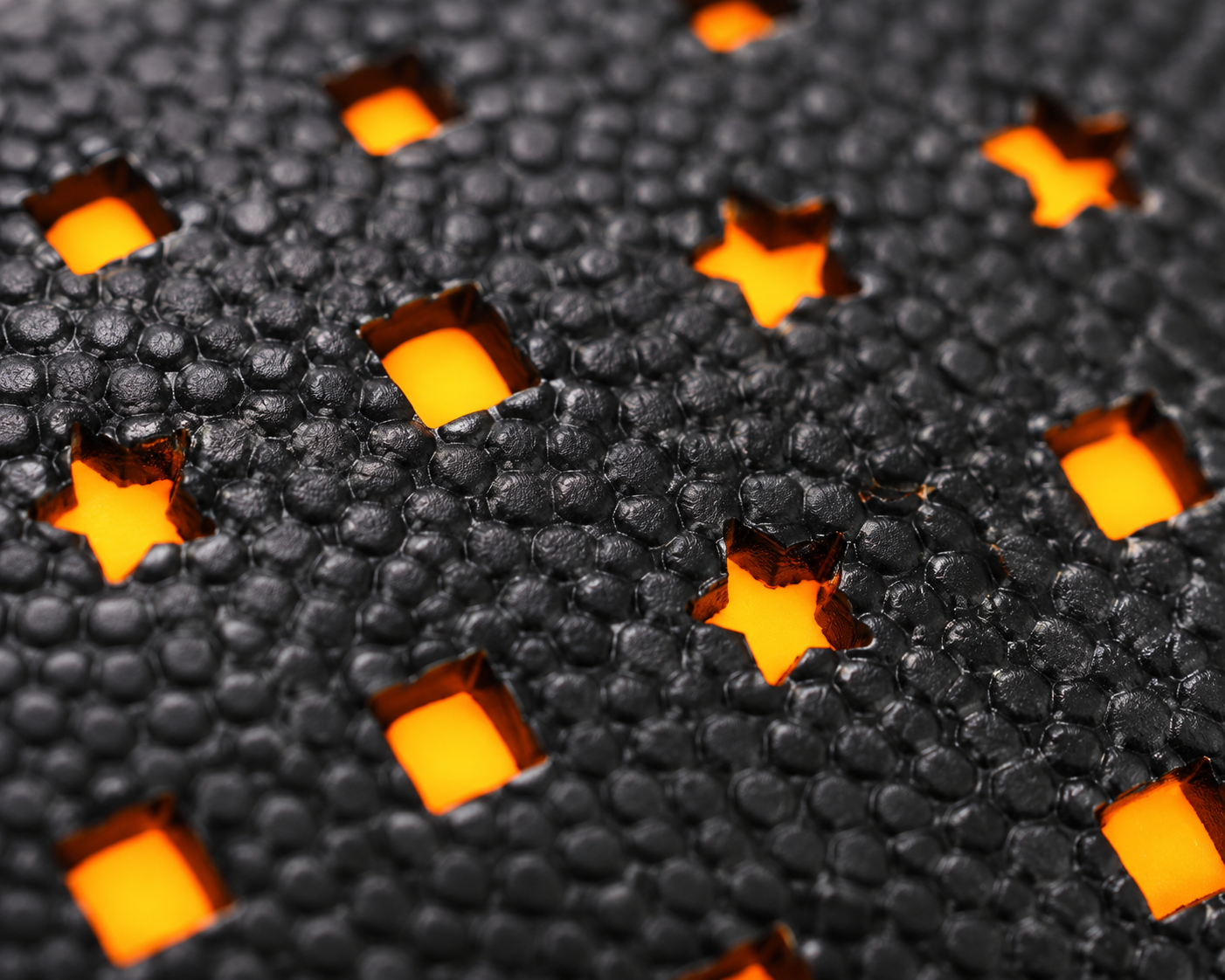 Close-up of the glowing orange stars and squares on the CIPTON LED football