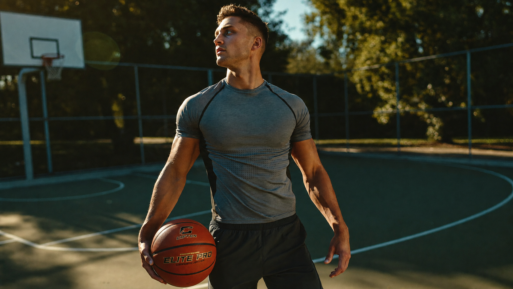 Athlete holding a CIPTON basketball on an outdoor court