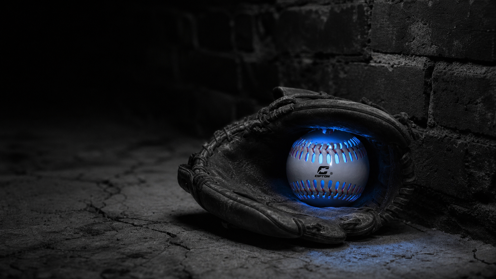 CIPTON LED baseball glowing blue inside a baseball glove at night