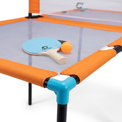 CIPTON Slam Pong Pro paddles and orange ball on the mesh table, corner detail on white background